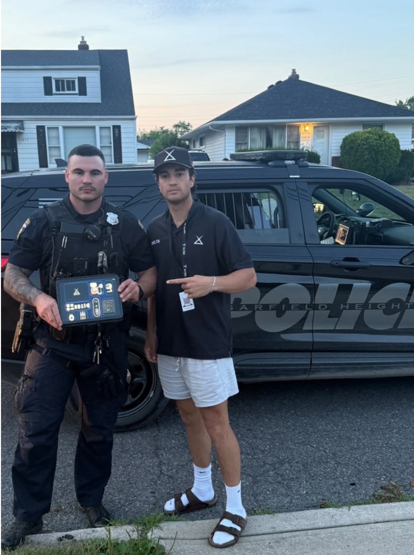 Delta Power Group team with local police at a neighborhood visit