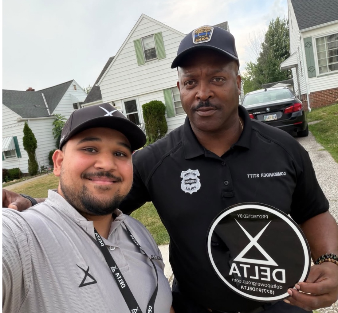 Delta Power Group with a local police commander in the community